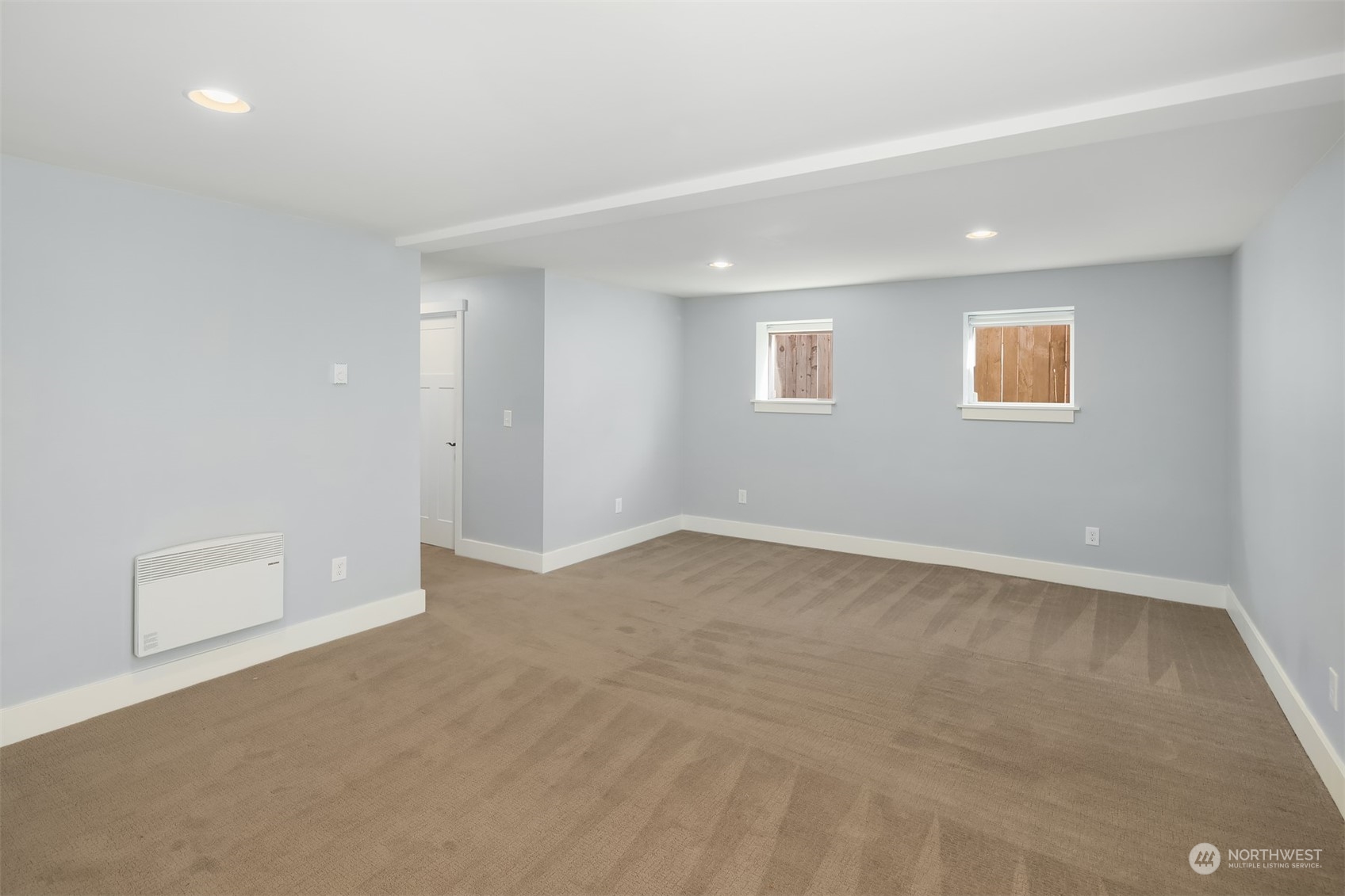 1112 North 76th Street Seattle, WA 98103 - Photo 26 of 40 a view of an empty room with a window