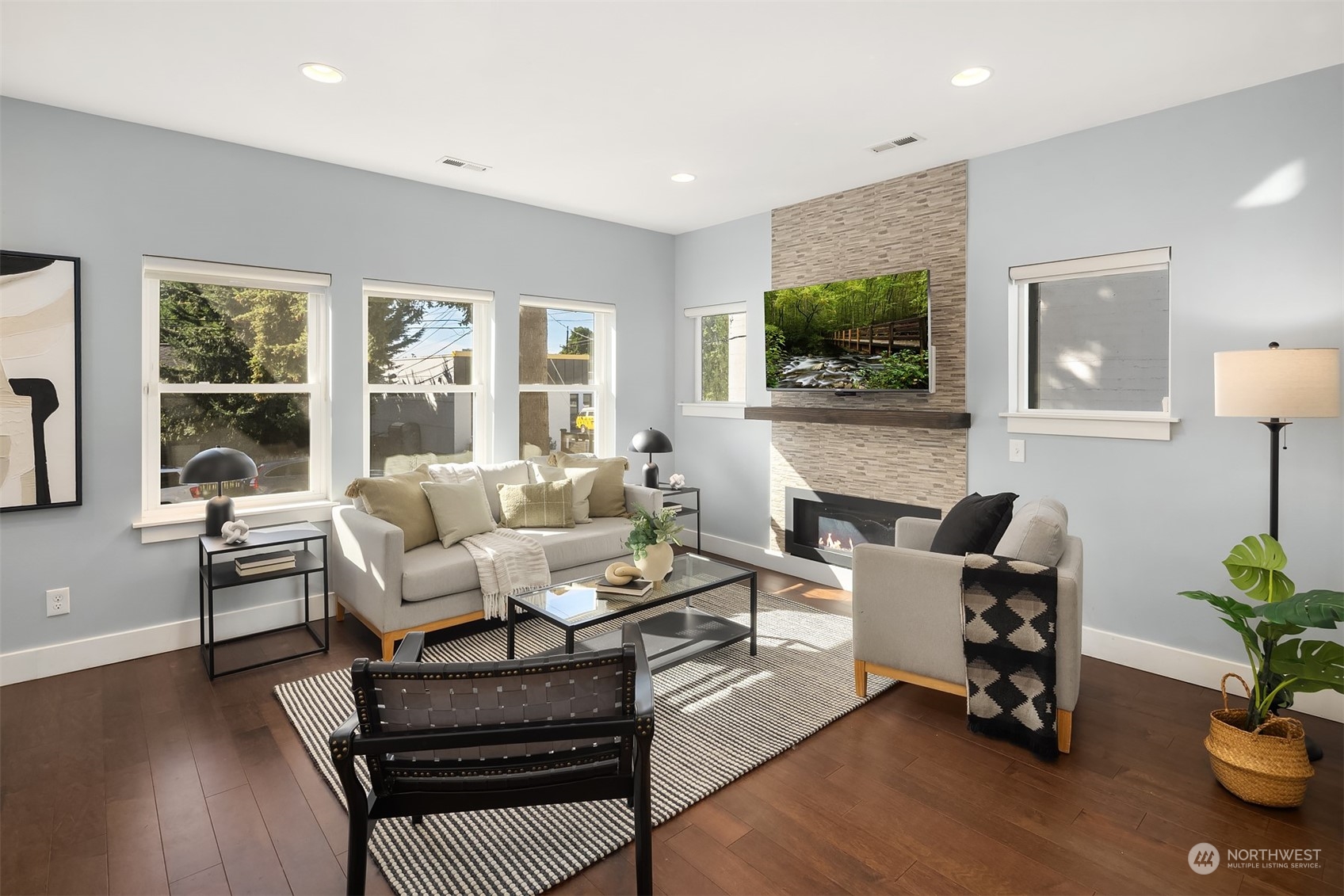 1112 North 76th Street Seattle, WA 98103 - Photo 7 of 40 a living room with furniture and a flat screen tv
