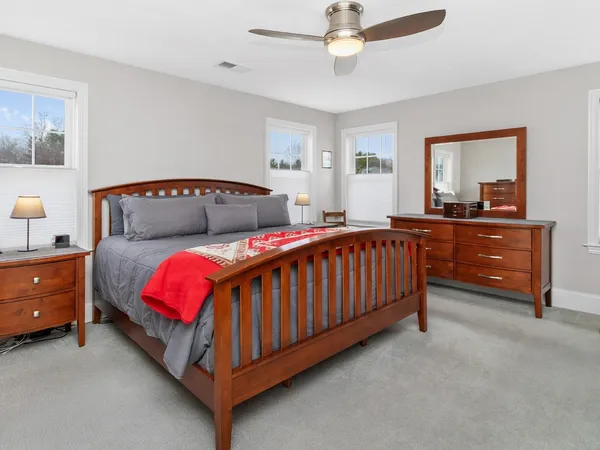 a bed room with a bed and a dresser