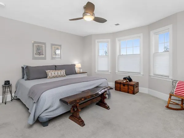 a bedroom with bed and window