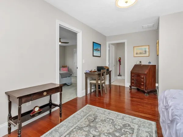 a living room with furniture and a dining table