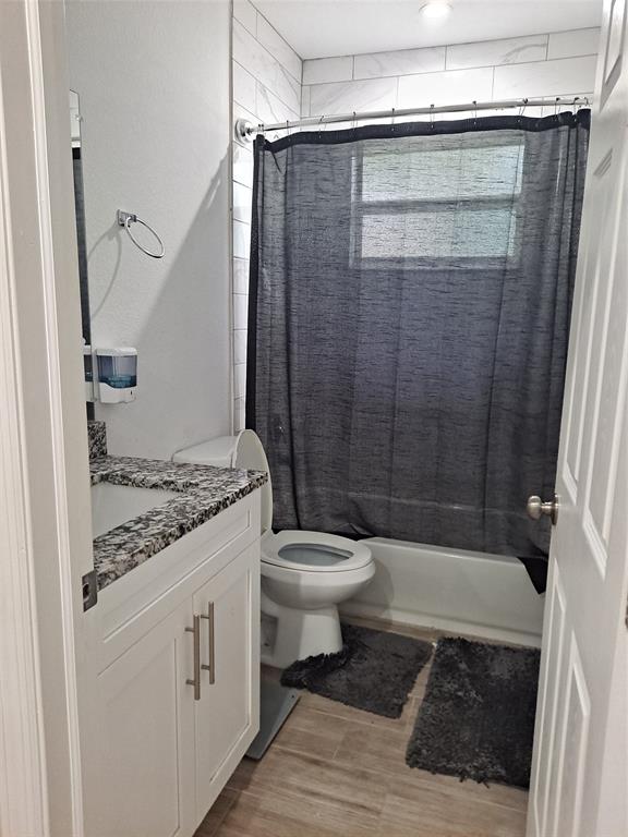 1635 West 15th Street Riviera Beach, FL 33404 - Photo 18 of 26 a bathroom with a granite countertop sink toilet and shower