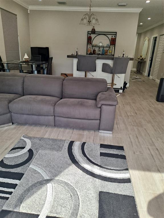 1635 West 15th Street Riviera Beach, FL 33404 - Photo 3 of 26 a living room with furniture and a fireplace