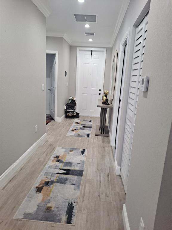 1635 West 15th Street Riviera Beach, FL 33404 - Photo 4 of 26 walk in closet with wooden floor