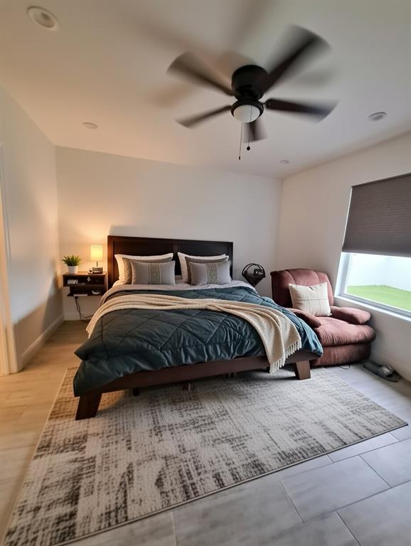 1635 West 15th Street Riviera Beach, FL 33404 - Photo 5 of 26 a bedroom with a bed and window