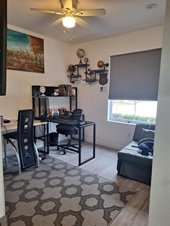 1635 West 15th Street Riviera Beach, FL 33404 - Photo 9 of 26 a living room with furniture and a window