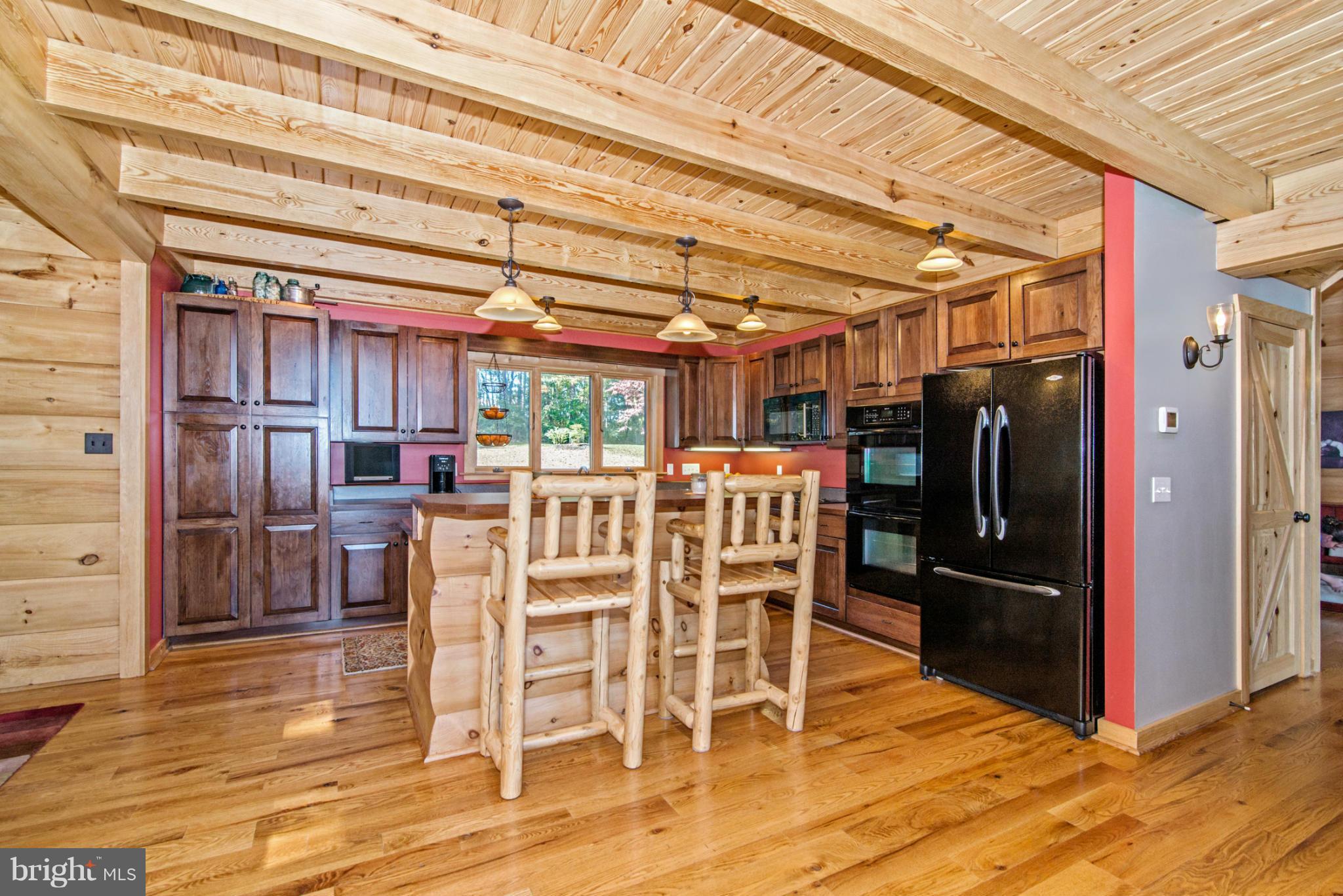 4731 Buffalo Road Mount Airy, MD 21771 - Photo 16 of 30 a dining room with furniture and wooden floor