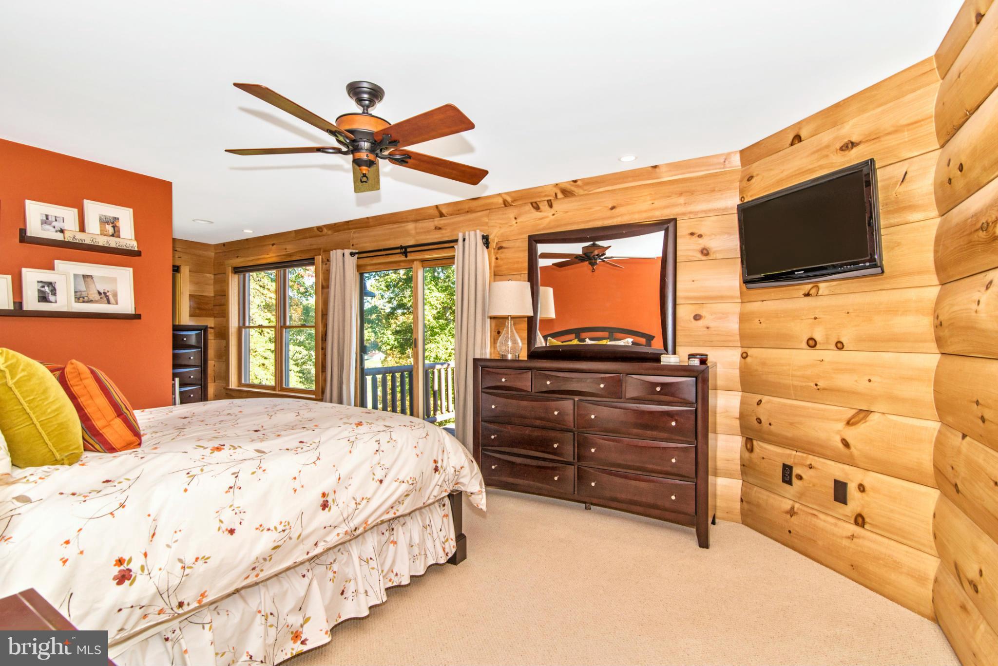 4731 Buffalo Road Mount Airy, MD 21771 - Photo 23 of 30 a bedroom with a bed a flat screen tv and dresser