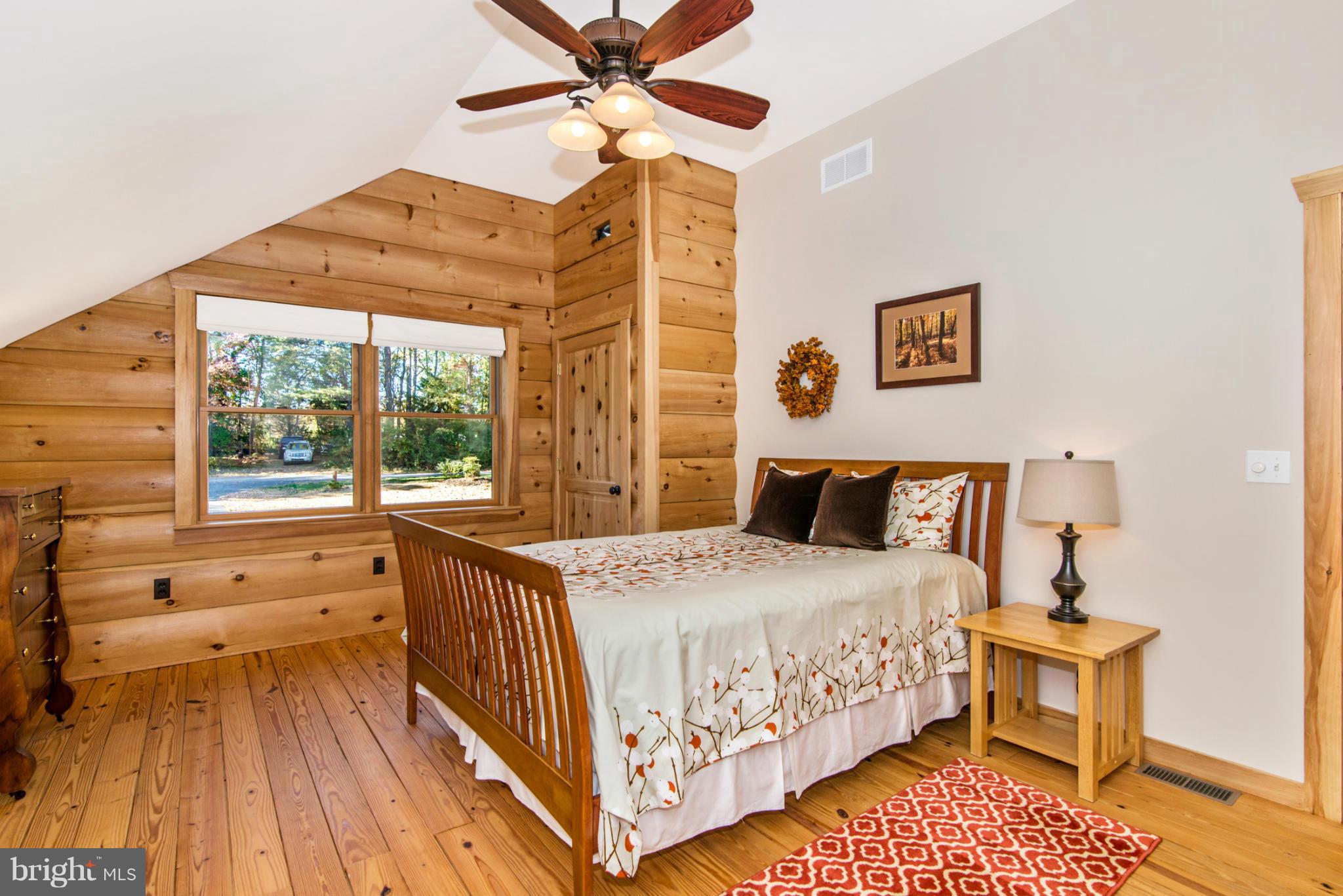4731 Buffalo Road Mount Airy, MD 21771 - Photo 27 of 30 a bedroom with a bed and a chandelier