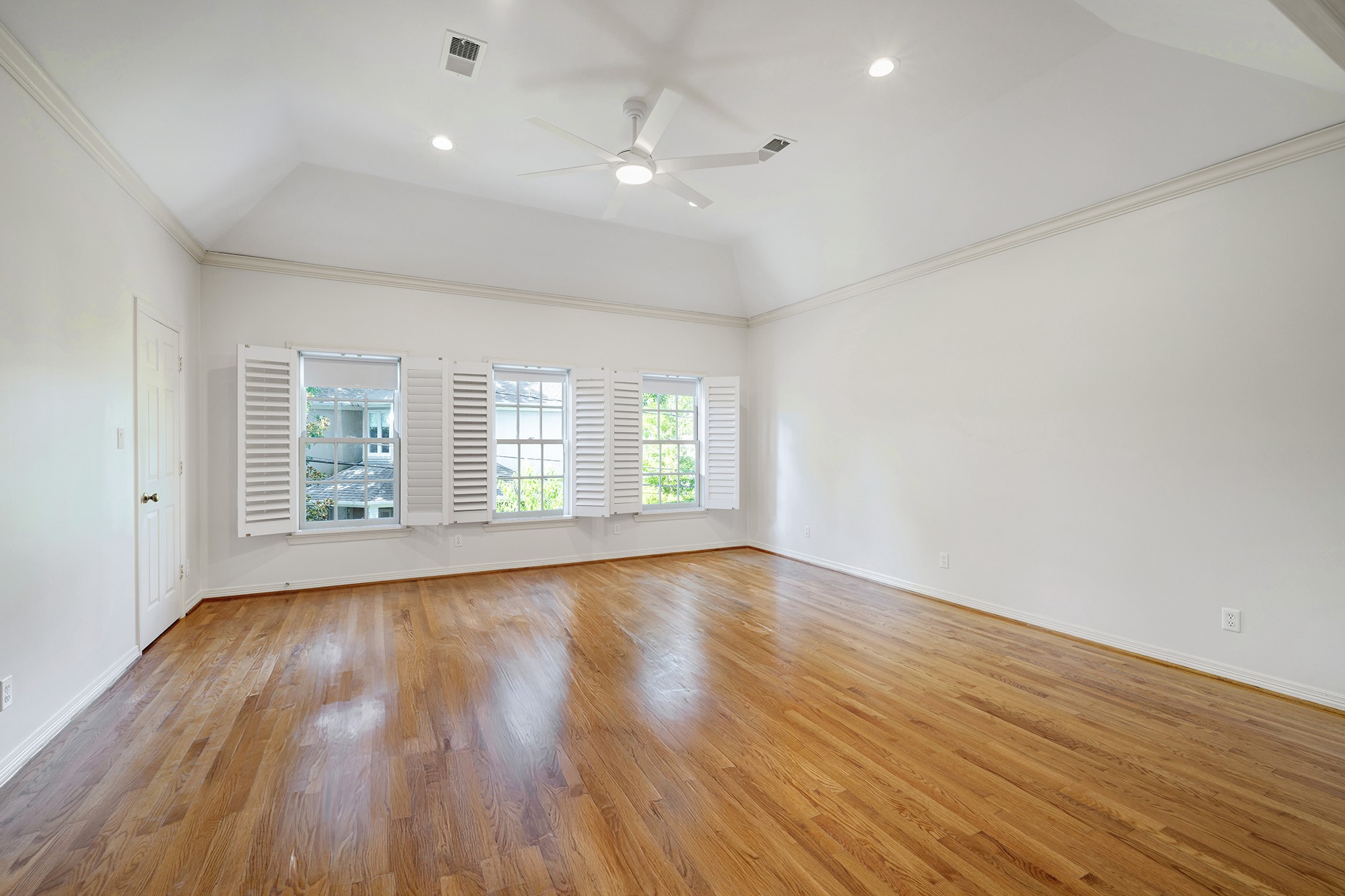 2709 Wroxton Road West University Place, TX 77005 - Photo 11 of 19 an empty room with wooden floor and windows