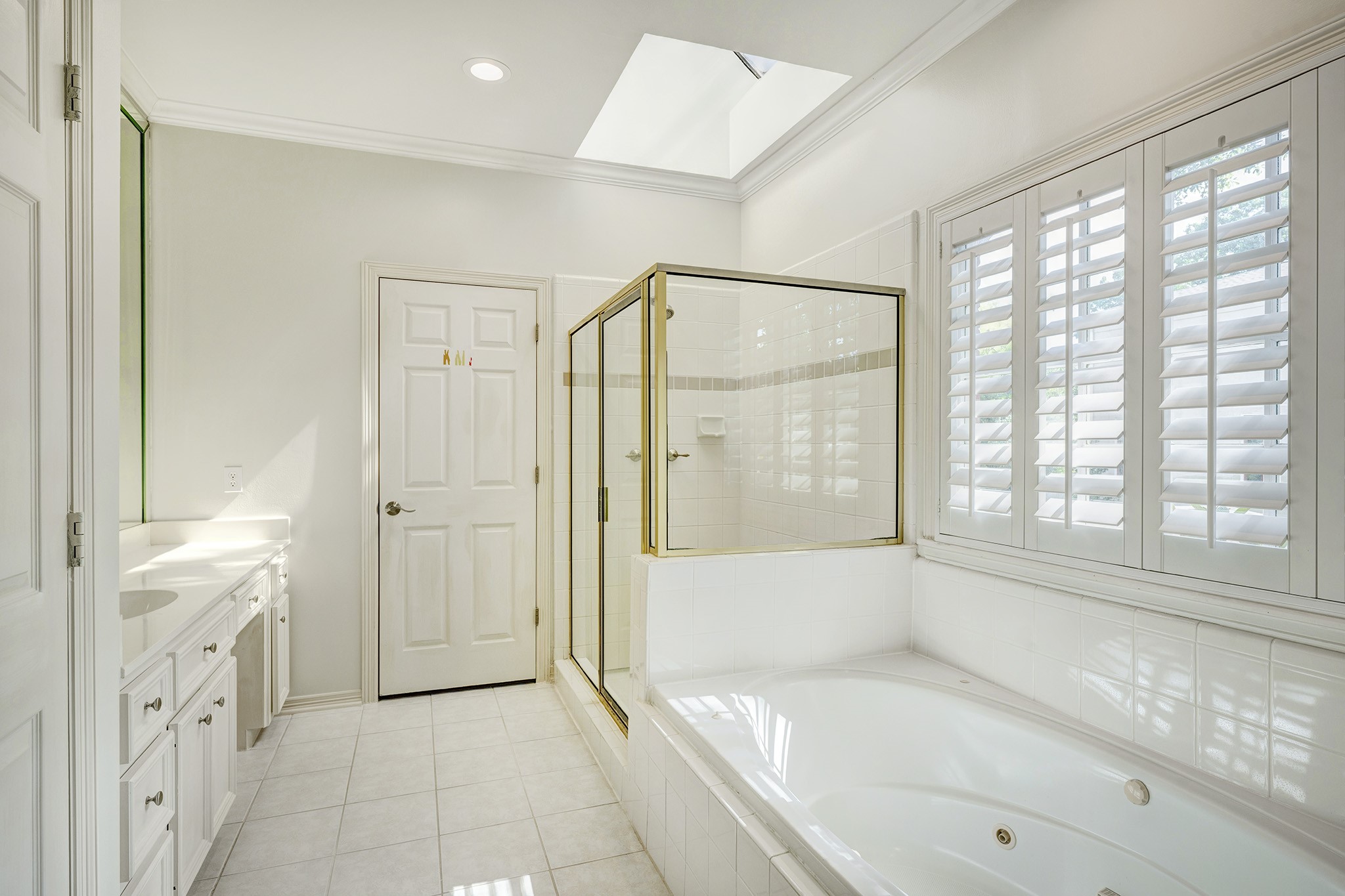 2709 Wroxton Road West University Place, TX 77005 - Photo 13 of 19 a bathroom with a tub shower and sink
