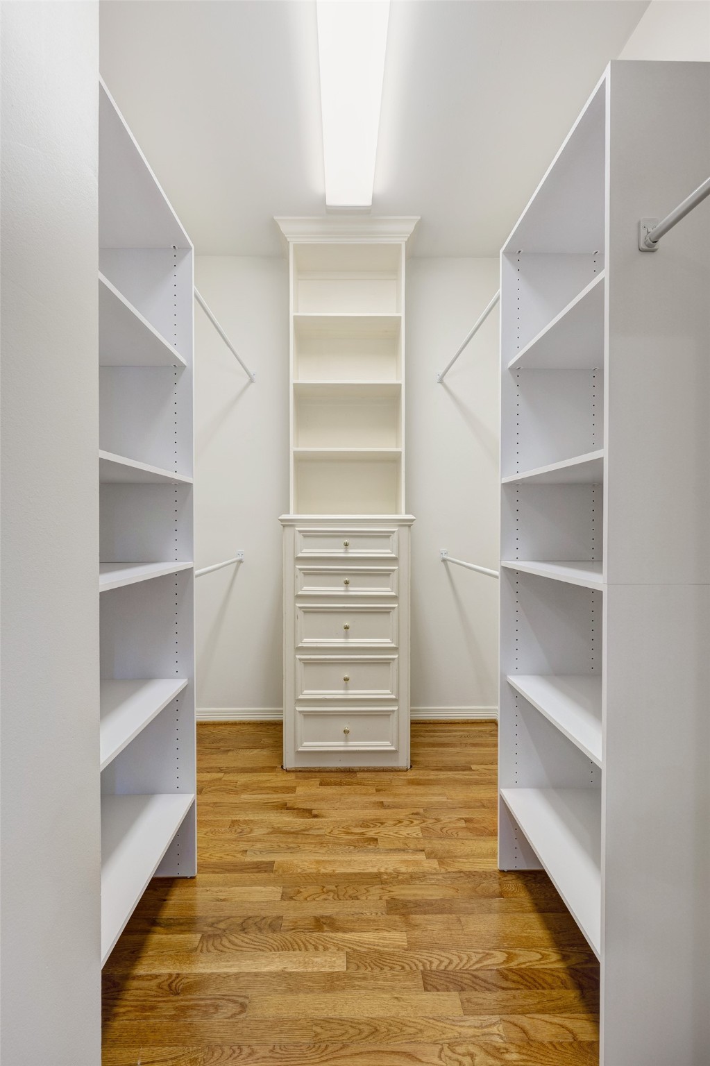 2709 Wroxton Road West University Place, TX 77005 - Photo 14 of 19 a view of walk in closet with empty racks