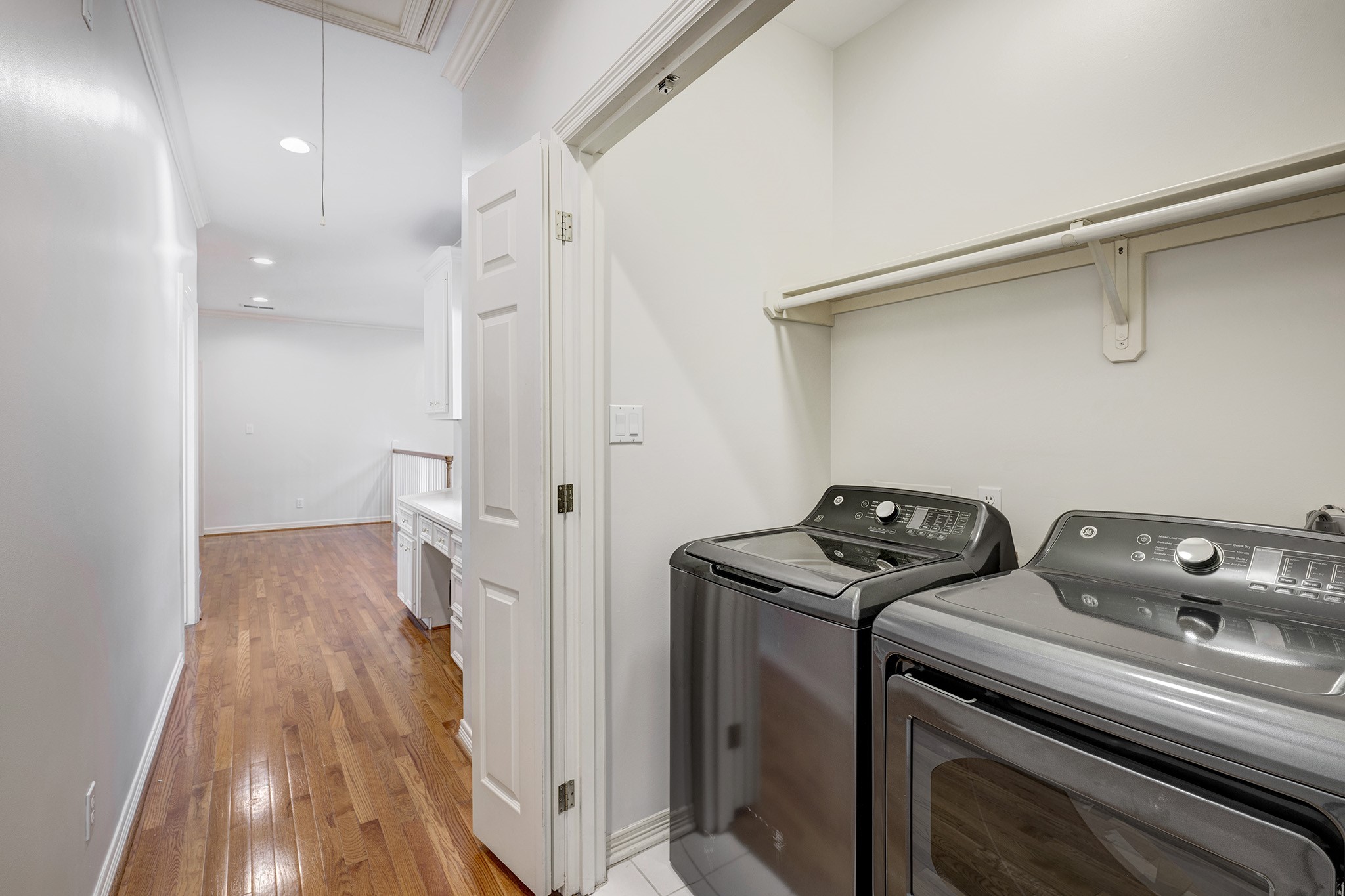 2709 Wroxton Road West University Place, TX 77005 - Photo 18 of 19 a view of a storage & utility room with closet wooden floor