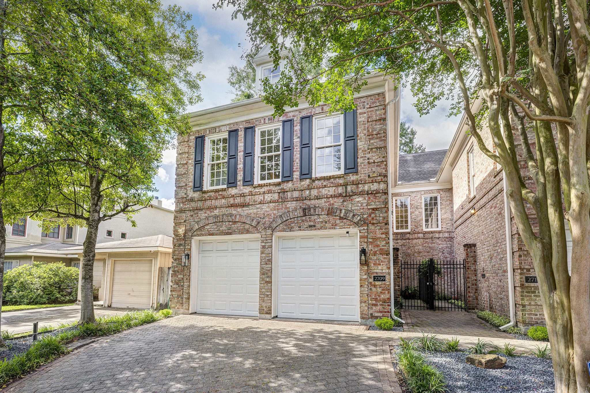 2709 Wroxton Road West University Place, TX 77005 - Photo 2 of 19 a front view of a house with a garden