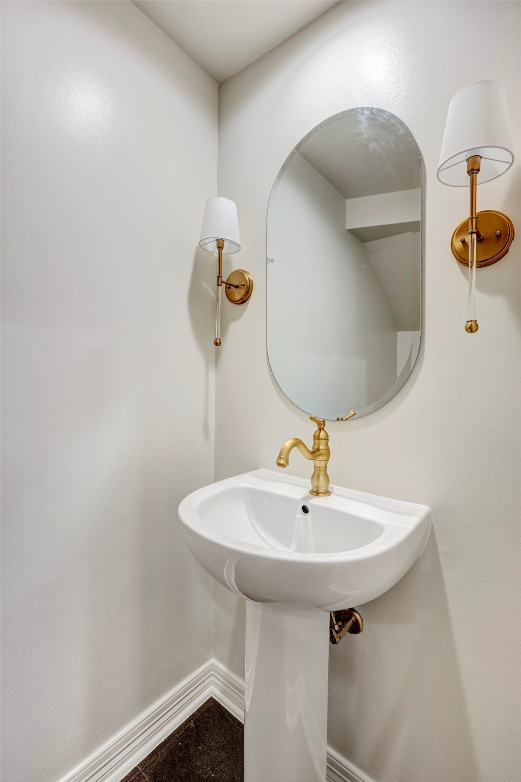 2709 Wroxton Road West University Place, TX 77005 - Photo 4 of 19 a bathroom with a sink and a mirror