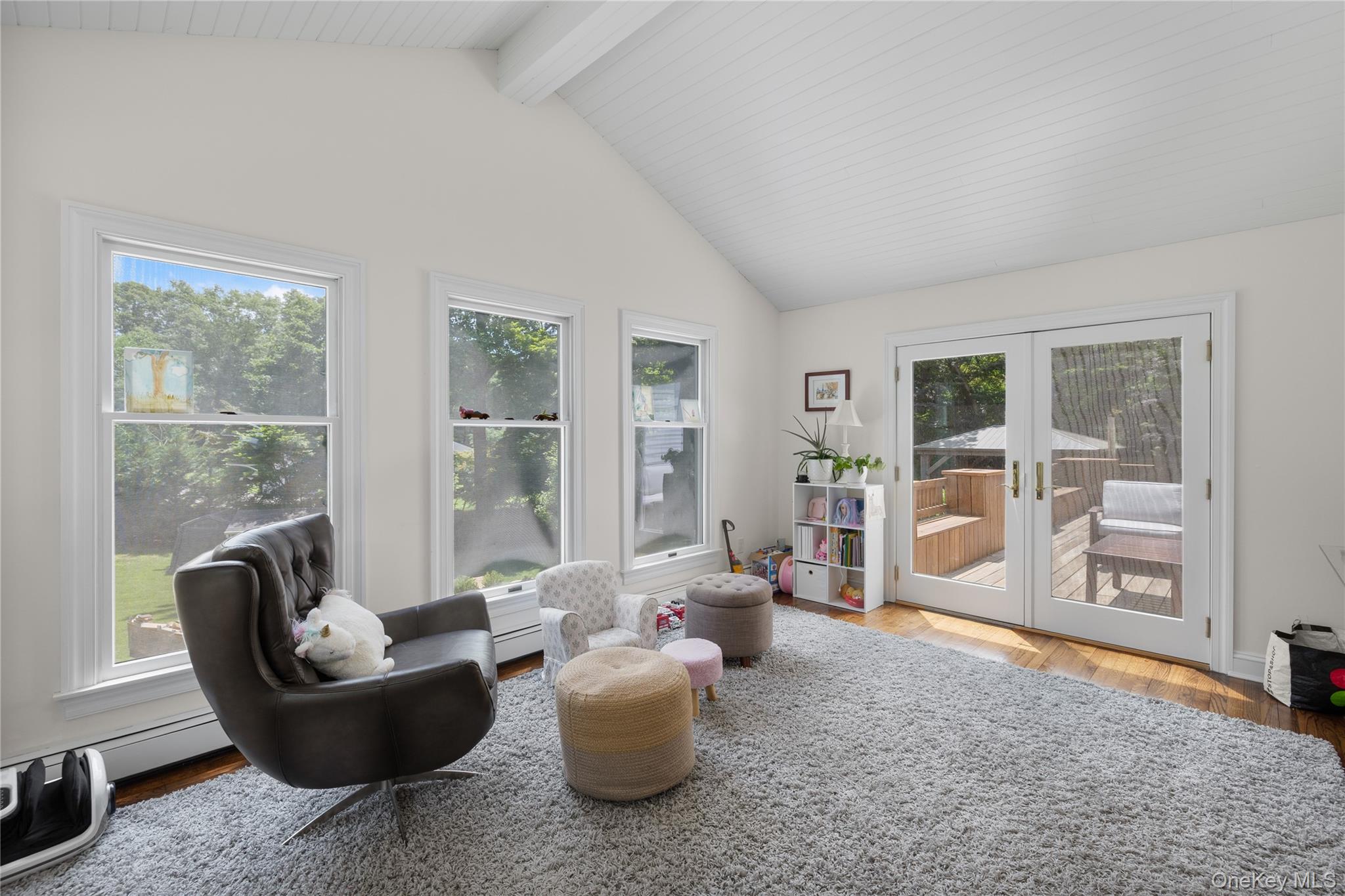 9 Three Sisters Road St. James, NY 11780 - Photo 10 of 36 Beautiful sun filled playroom or office with wood floors and sliding glass doors leading to deck