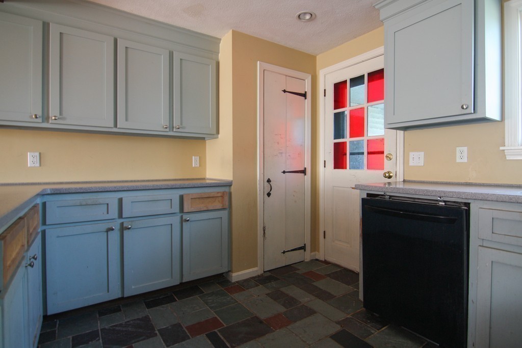 43 Forge Village Road Groton, MA 01450 - Photo 8 of 21 a kitchen with white cabinets and sink