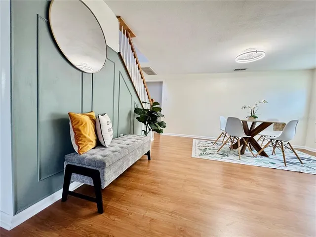 a view of an entryway with wooden floor