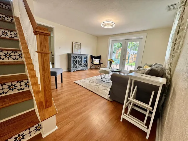 a kitchen with granite countertop a stove microwave and sink