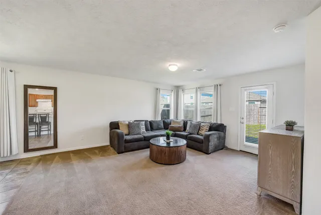 a living room with furniture and a window