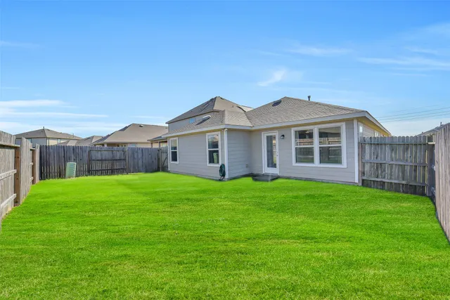 a backyard of a house with lots of green space