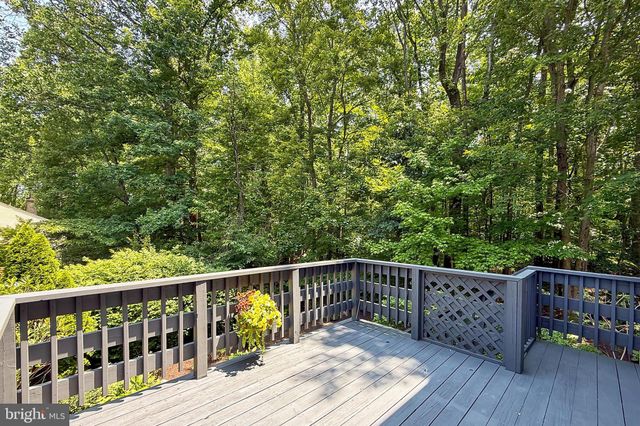 a view of a wooden deck and a yard