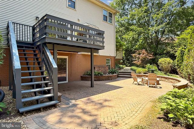 a front view of a house with a potted plant