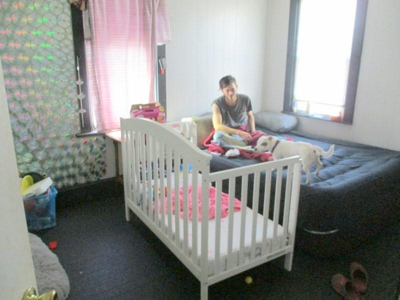 1503 3rd Avenue Beaver Falls, PA 15010 - Photo 7 of 14 a bedroom with furniture and a window