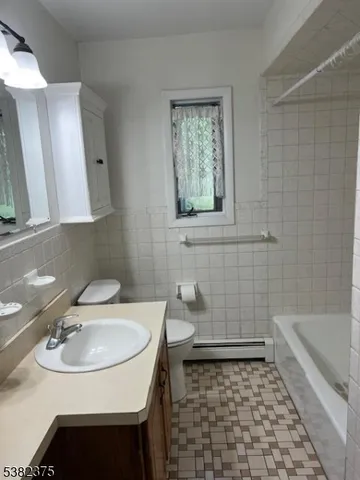 a view of a grassy field with trees