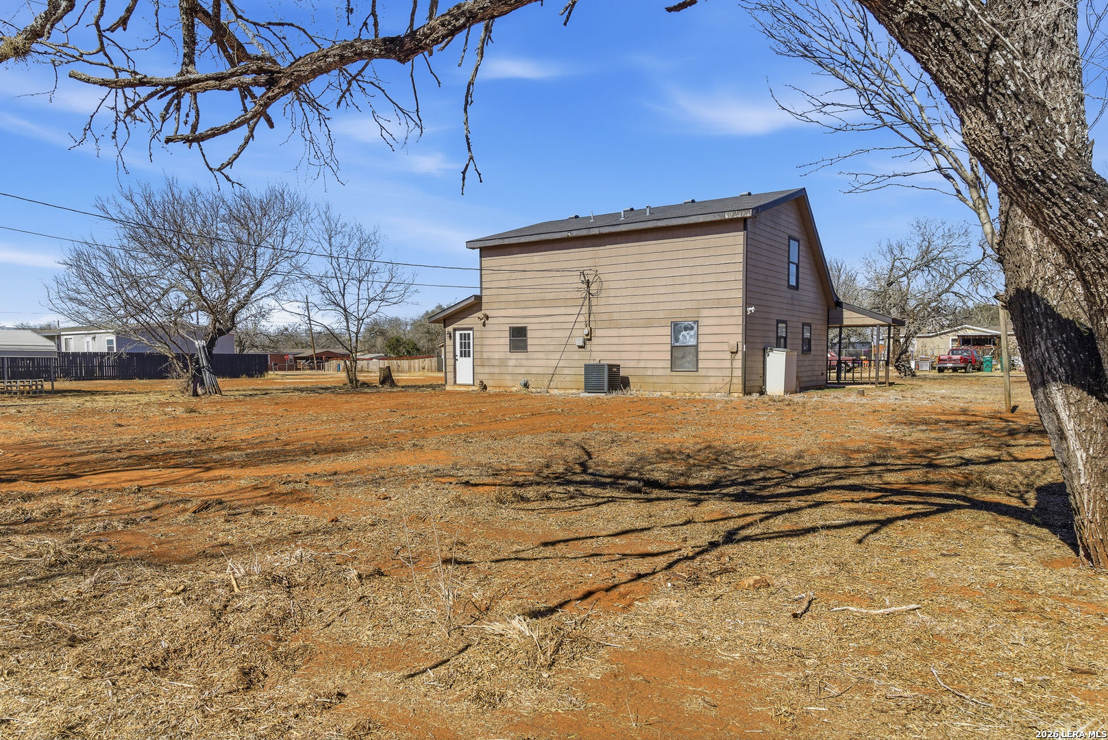 910 Cypress Street Jourdanton, TX 78026 - Photo 25 of 25 a view of a house with snow on the side of road