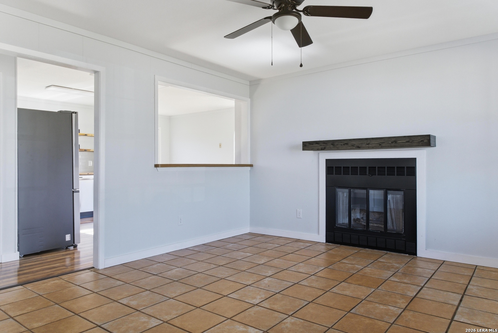 910 Cypress Street Jourdanton, TX 78026 - Photo 5 of 25 a view of an empty room and window