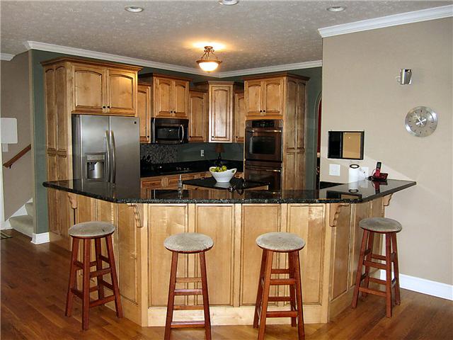 1909 Shell Road Hendersonville, TN 37075 - Photo 4 of 20 The Kitchen has granite counters, double ovens, large island, smooth cook top, pantry, huge bar, and hardwood floors.