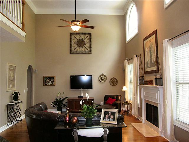 1909 Shell Road Hendersonville, TN 37075 - Photo 6 of 20 The Living Room has soaring ceilings, a fireplace, hardwood floors, and large windows that let in lots of natural light.