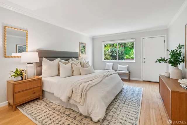 a bedroom with bed and a window