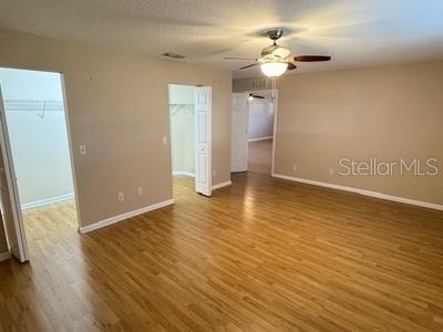 9759 Southwest 97th Lane Ocala, FL 34481 - Photo 19 of 28 wooden floor in an empty room with a window