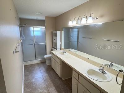 9759 Southwest 97th Lane Ocala, FL 34481 - Photo 21 of 28 a bathroom with a sink double vanity and a mirror
