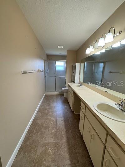 9759 Southwest 97th Lane Ocala, FL 34481 - Photo 22 of 28 a bathroom with a sink double vanity and a mirror