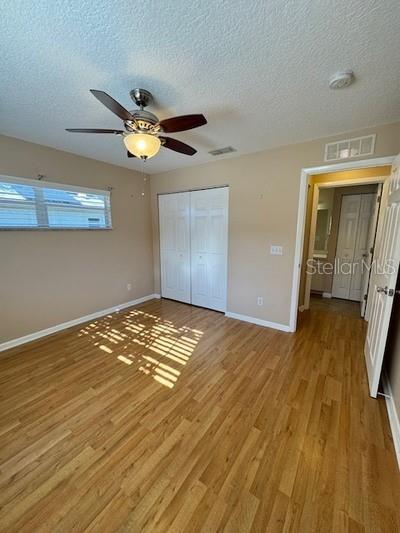 9759 Southwest 97th Lane Ocala, FL 34481 - Photo 24 of 28 a view of empty room with wooden floor
