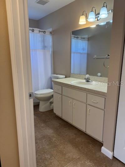 9759 Southwest 97th Lane Ocala, FL 34481 - Photo 26 of 28 a bathroom with a sink toilet and shower
