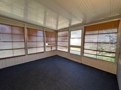 9759 Southwest 97th Lane Ocala, FL 34481 - Photo 27 of 28 wooden floor in an empty room with a window