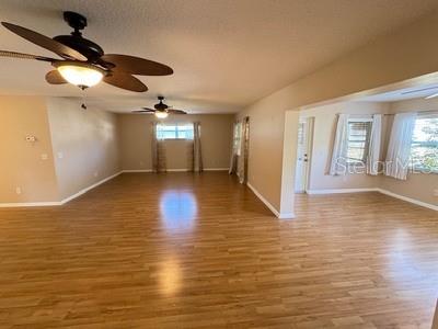 9759 Southwest 97th Lane Ocala, FL 34481 - Photo 9 of 28 a view of empty room with wooden floor
