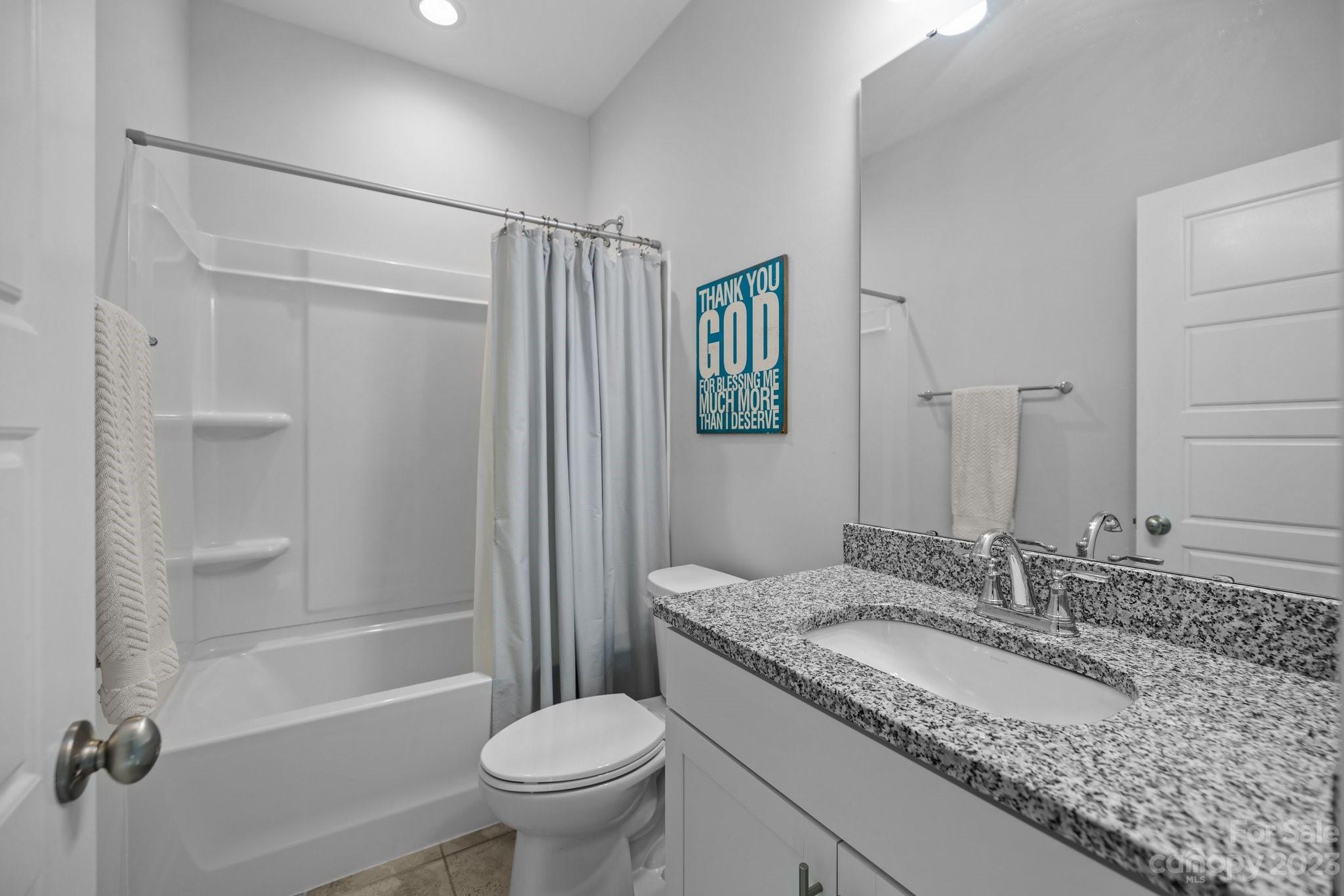 4132 Oarman Court Fort Mill, SC 29708 - Photo 32 of 42 a bathroom with a granite countertop sink toilet and shower