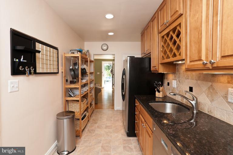 182 Brandon Road Baltimore, MD 21212 - Photo 2 of 30 a kitchen with stainless steel appliances granite countertop a sink stove and refrigerator