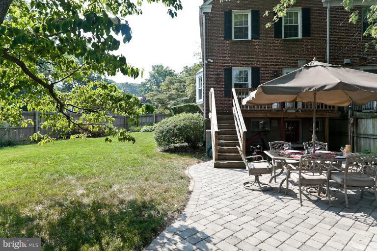 182 Brandon Road Baltimore, MD 21212 - Photo 17 of 30 a view of a patio with table and chairs under an umbrella