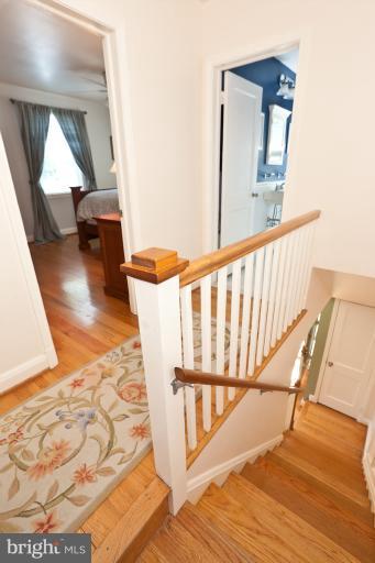 182 Brandon Road Baltimore, MD 21212 - Photo 6 of 30 a view of a hallway with wooden floor and stairs