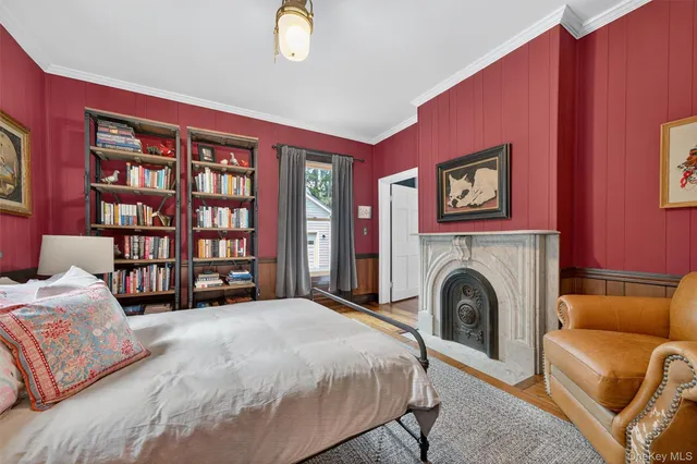 a spacious bedroom with a bed and a couch