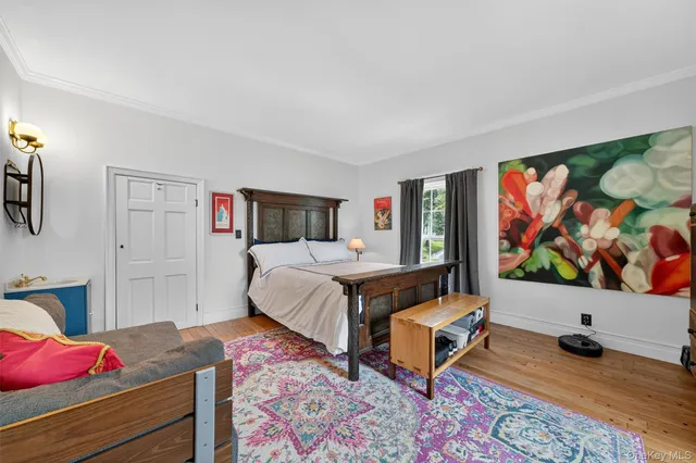 a bed room with furniture and window