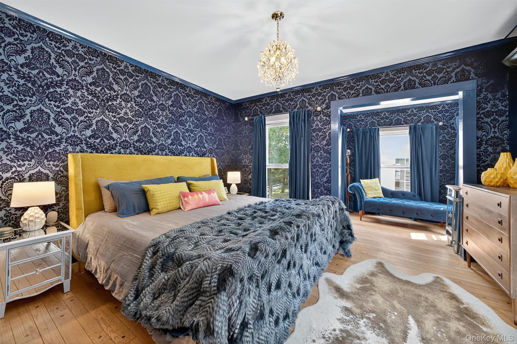 1657 River Road Damascus, PA 18415 - Photo 31 of 43 a bedroom with a bed and a large mirror on dresser with wooden floor