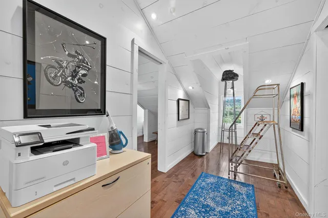 a view of entryway with workspace and stairs