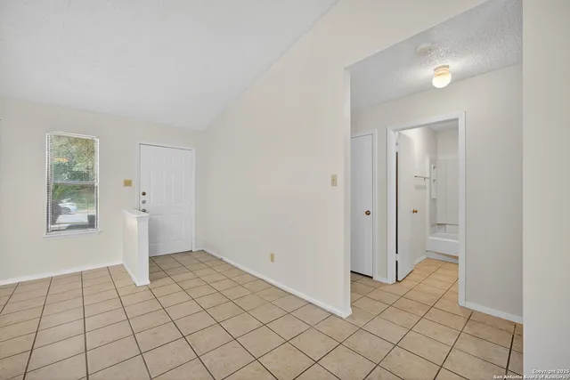 a view of an empty room and window